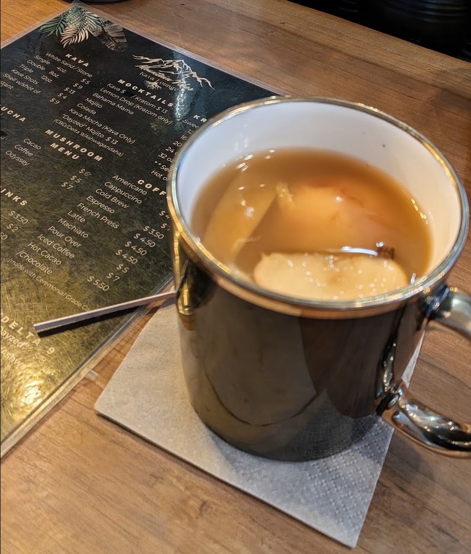 A fresh pour on a table next to the house menu